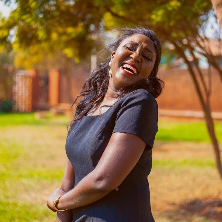 Alex Kim, Lead Design Curator at Celestial Planet Hub, reviewing corporate floral arrangements